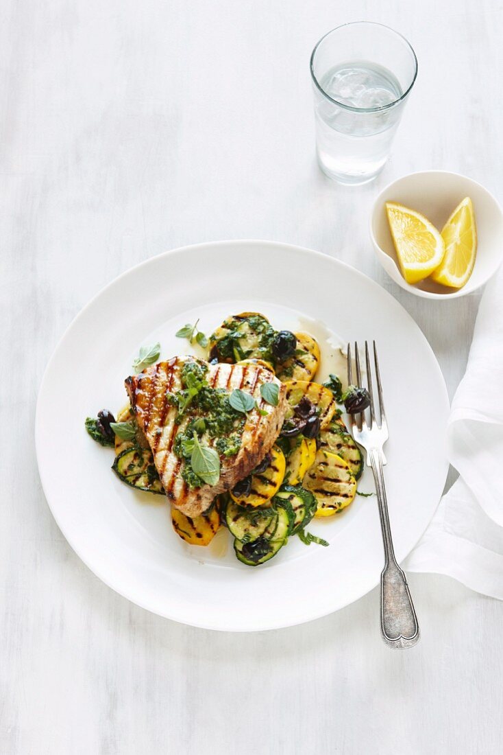 Grilled swordfish steak with courgette and squash