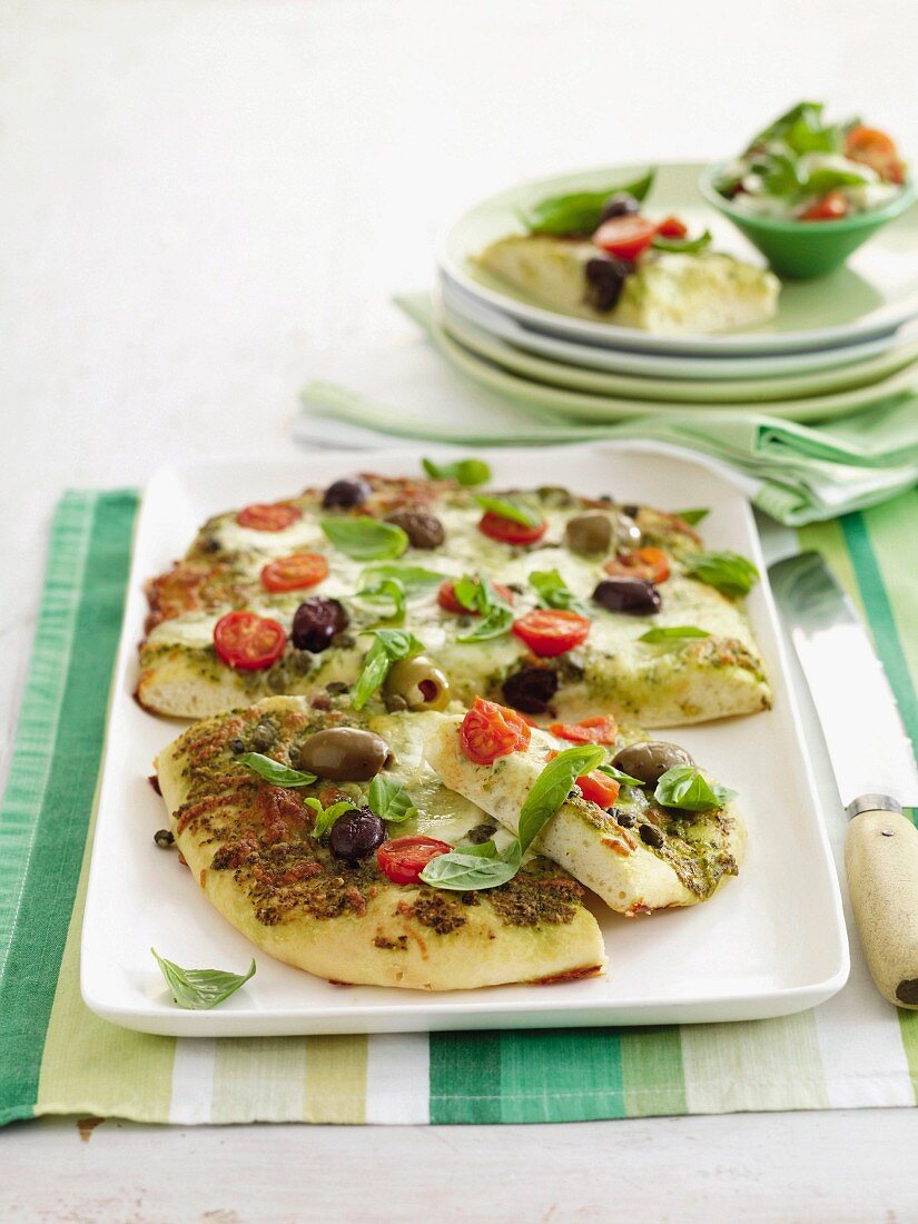 Pizza with basil and tomatoes