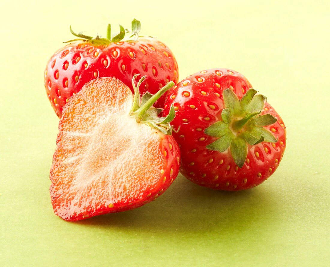 Two whole and one half strawberry