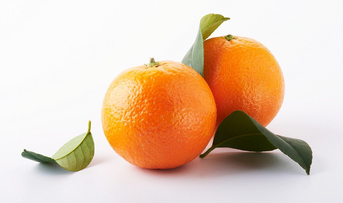 Two Whole Oranges; One with Leaf