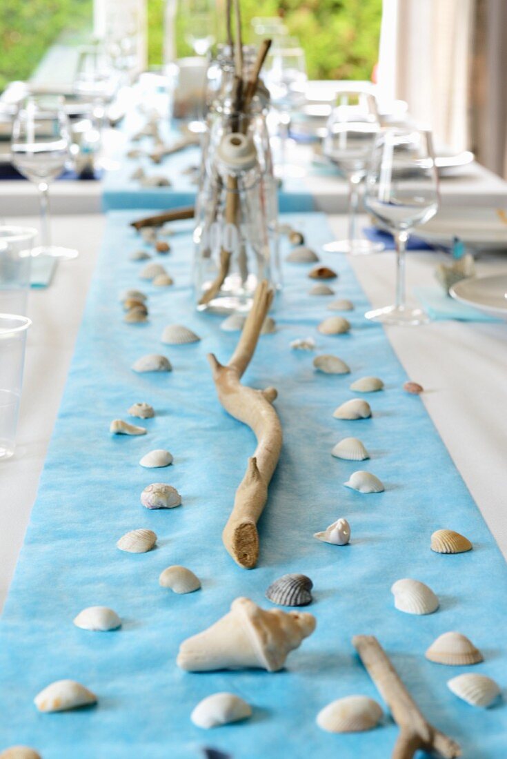 Maritime table decoration of shells and twigs