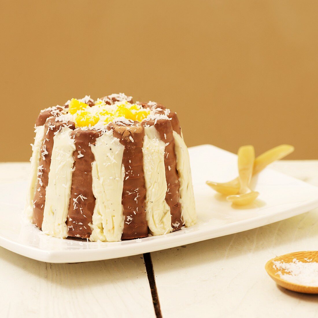 Chocolate charlotte with coconut, mango and pineapple