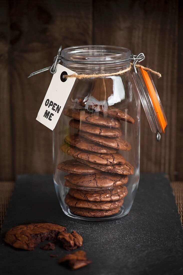 dark chocolate cookies in the jar with the label
