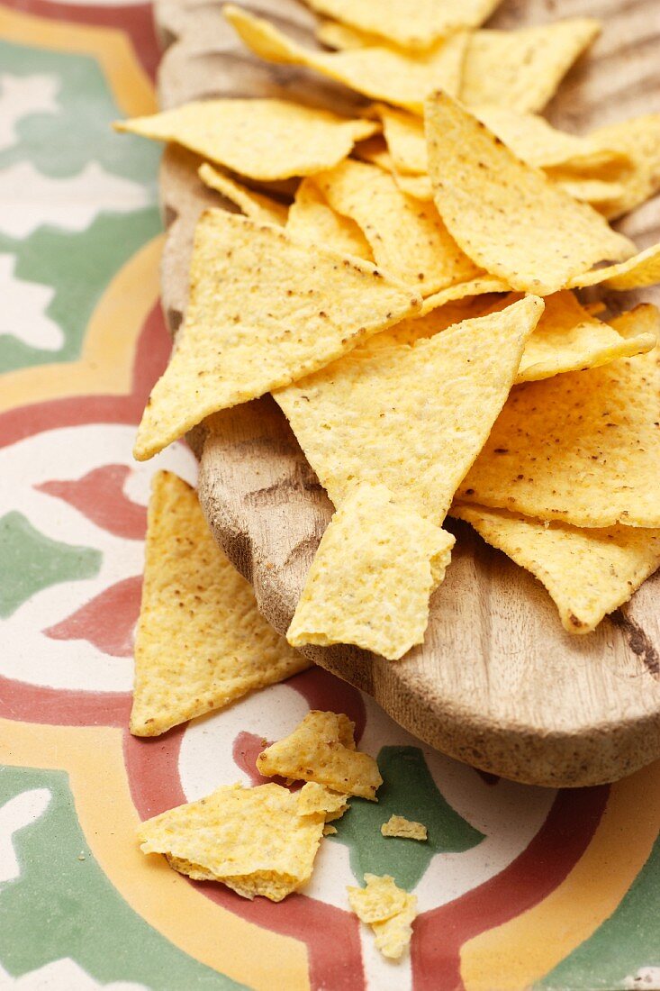 Tortilla chips in a wooden bowl
