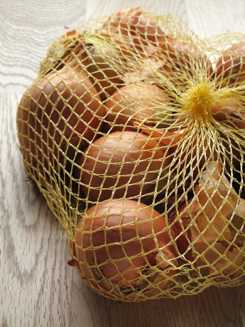Brown onions in net