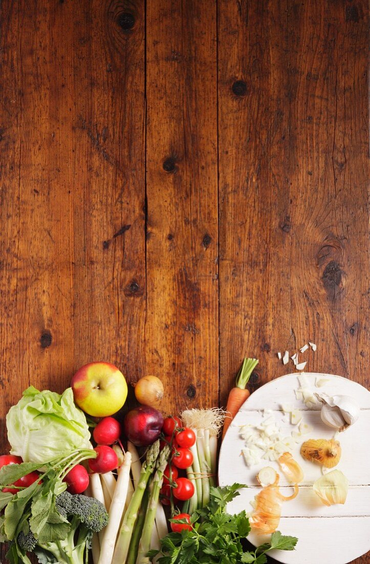 Vegetables and fruit on a wooden slab