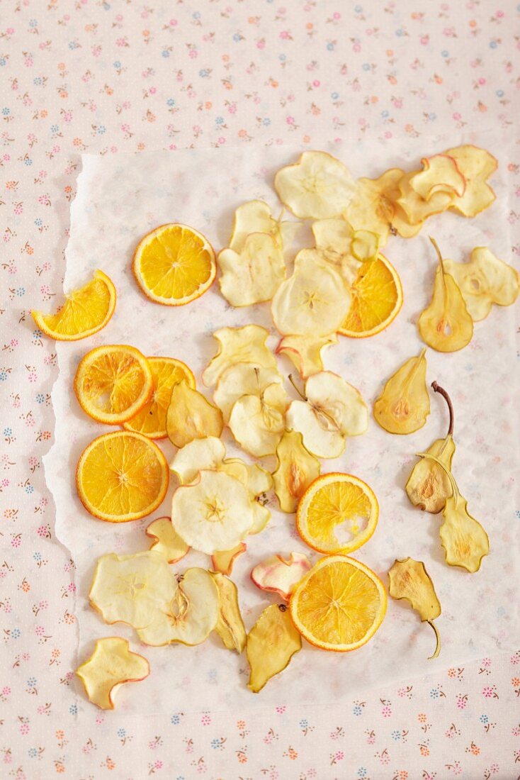 Fruit crisps laid out to dry on grease-proof paper