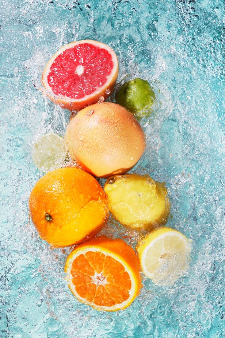 Assorted citrus fruits in water