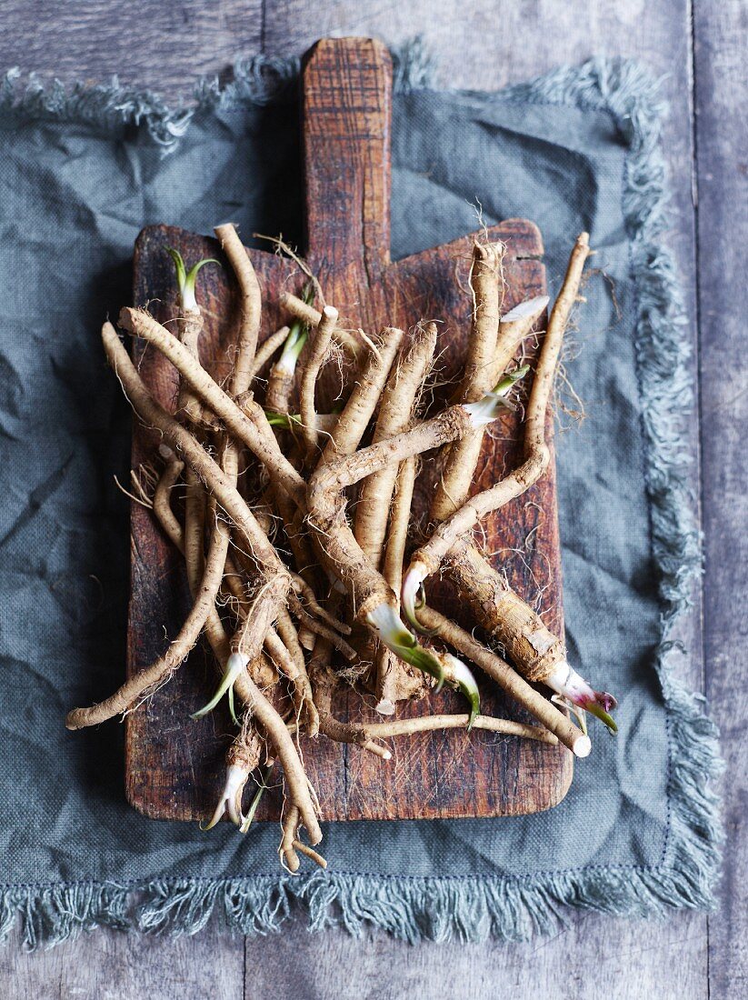 Fresh horseradish on a chopping board