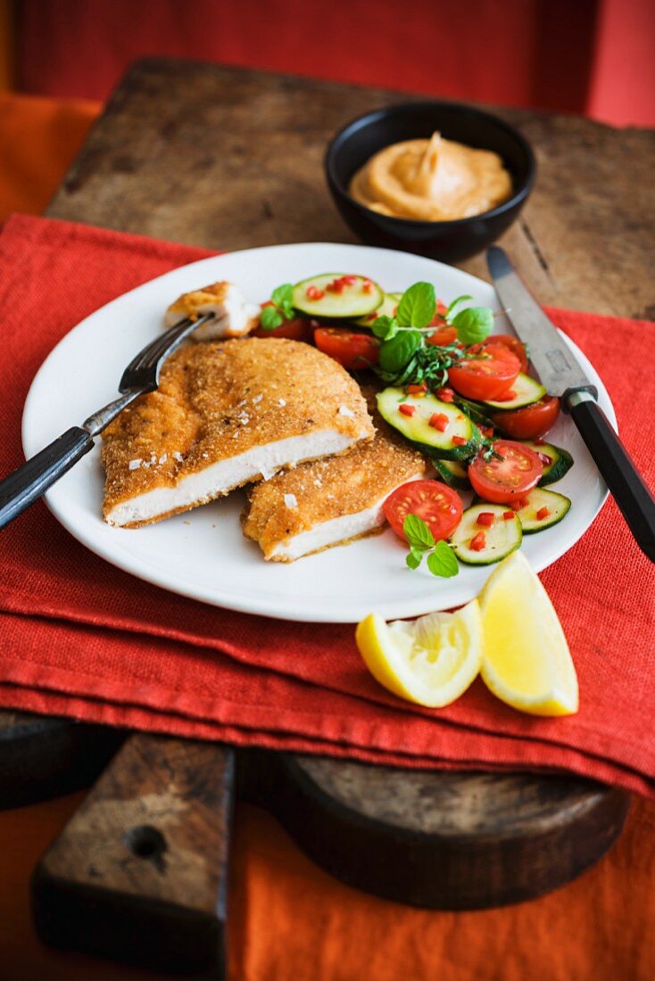 Breaded schnitzel with vegetable accompaniments