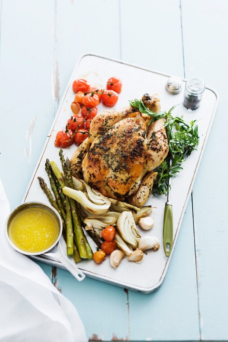 Roast chicken with tarragon and roasted vegetables