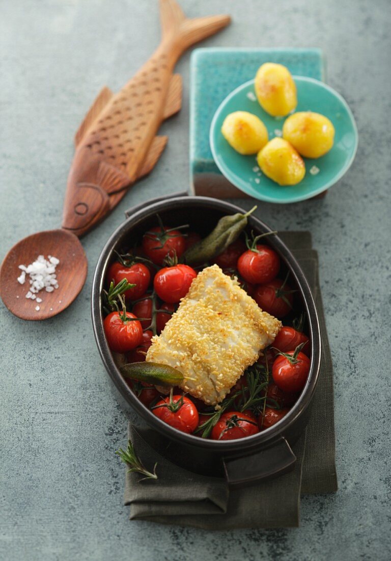 Cod fillet with crispy topping on oven-roasted tomatoes