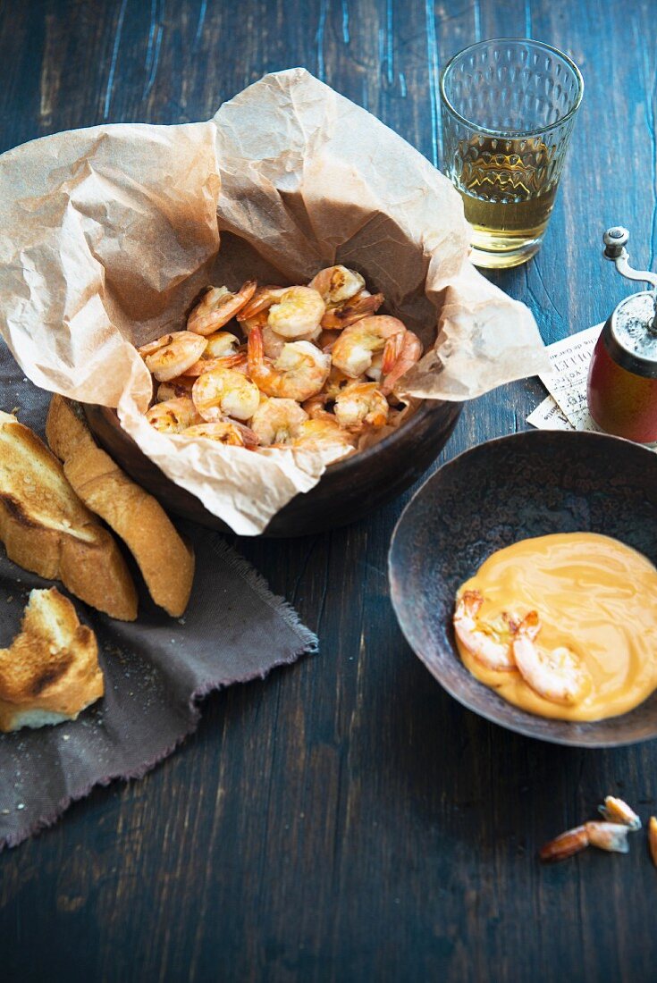 Baked prawns with cocktail sauce and freshly toasted baguette