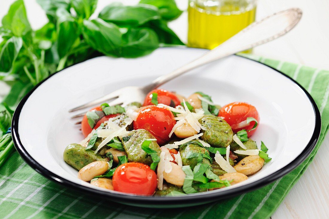 Basil gnocchi with white beans, tomatoes and balsamic vinegar