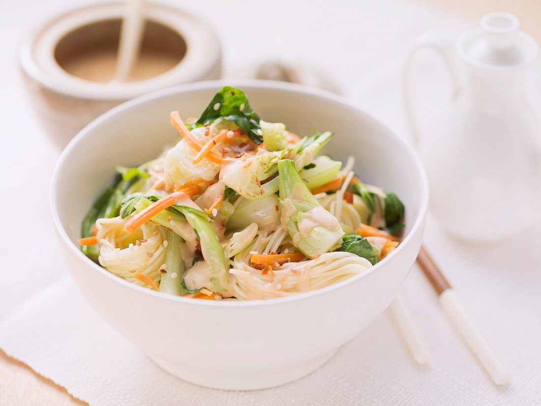 Rice noodles with carrots, pak choi and peanut sauce (Asia)