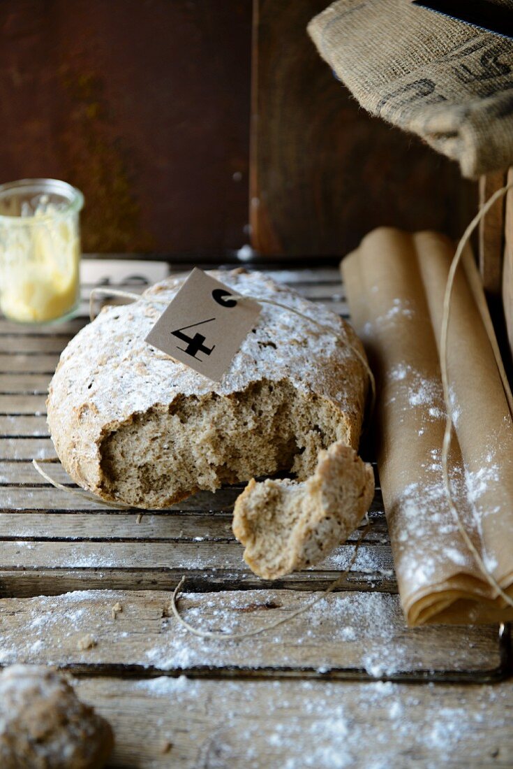 Rye bread, broken open, on a floury surface