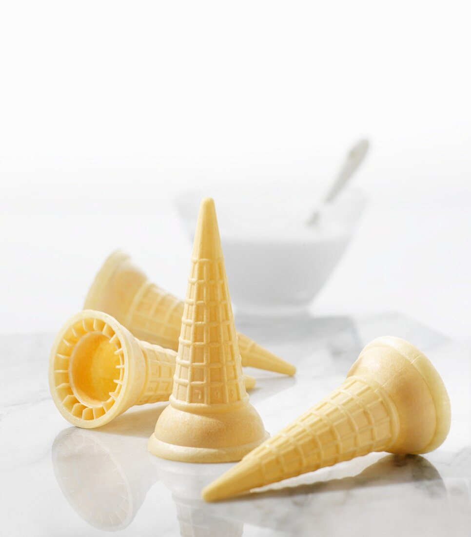 Four ice cream cones on a marble slab