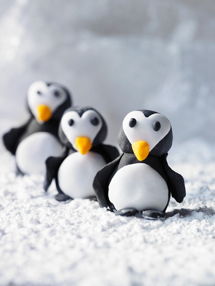 Three marzipan penguins