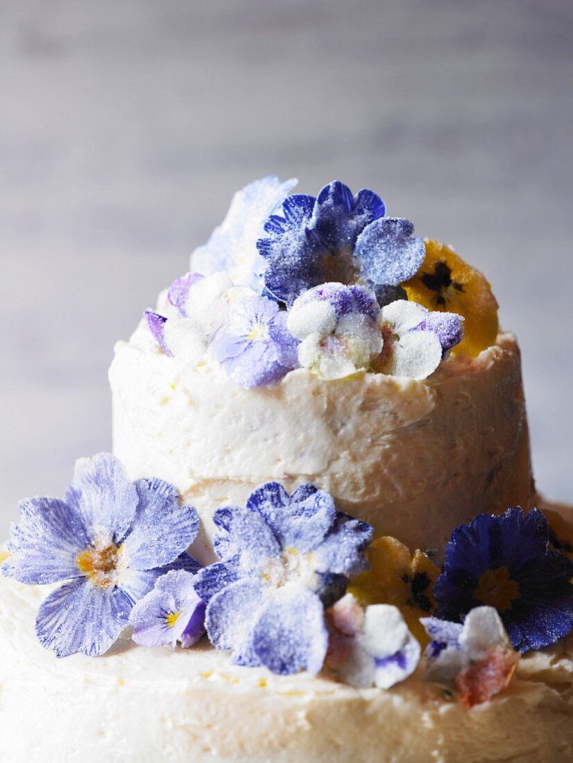 A wedding cake with sugared spring flowers