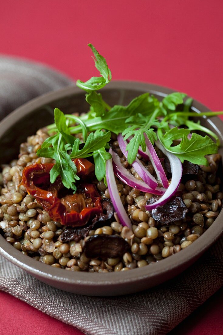 Lentil salad with sundried tomatoes, rocket and olives