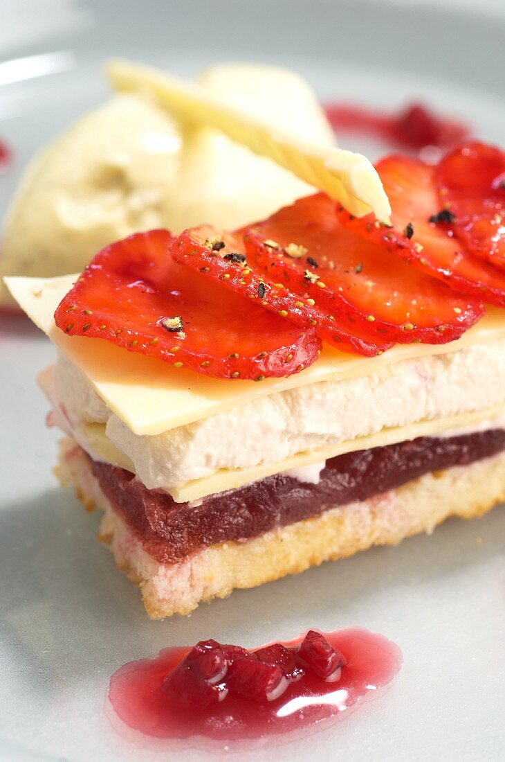 Layered strawberry dessert with vanilla ice cream