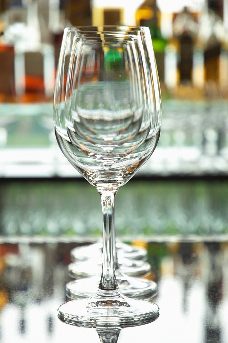 A row of empty wine glasses