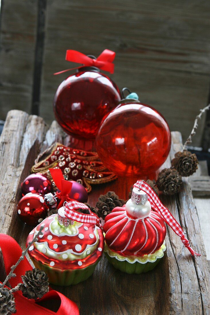 Assorted Christmas tree decorations: red baubles and muffins