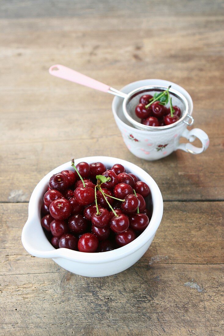 Fresh cherries on an old farmhouse table