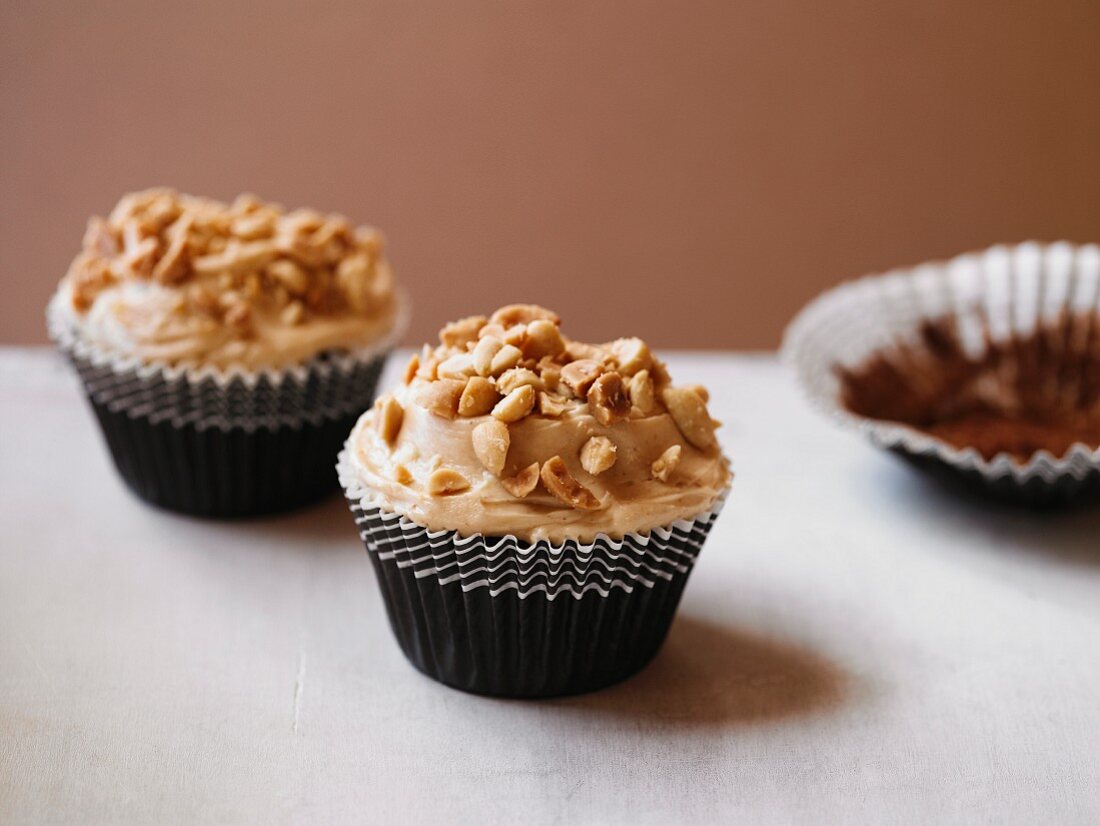 Chocolate & peanut butter cupcakes with chopped peanuts