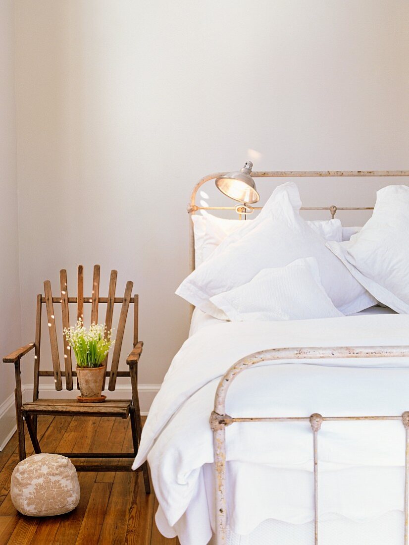 Bedroom with antique bed and flowers