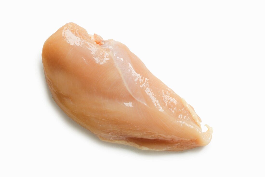 A Single Raw Chicken Breast on a White Background