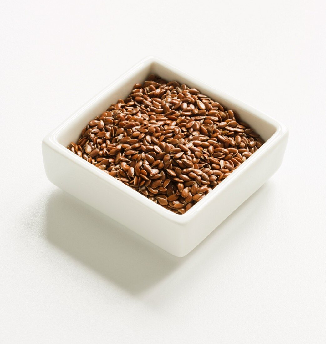 Flax Seeds in a Square White Bowl