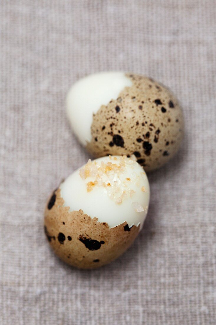 Two boiled quail's eggs with salt