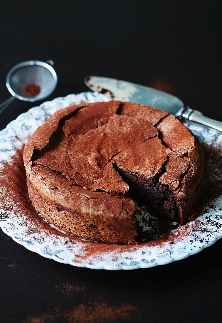Flourless chocolate cake, one slice cut