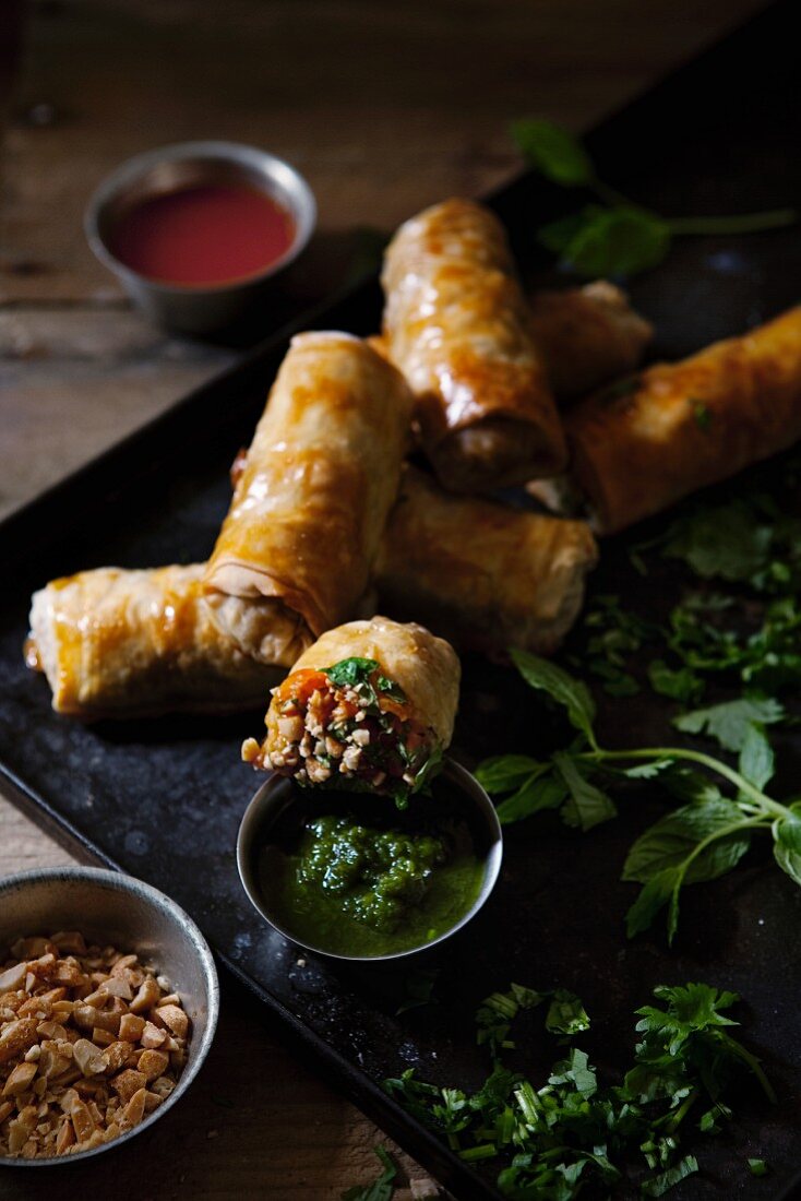 Mini yufka dough rolls with a herb and tomato dip