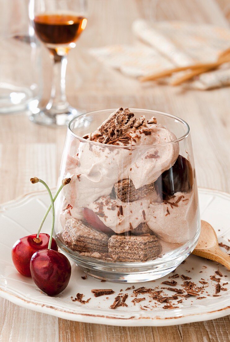 Chocolate mousse with cherries and wafers