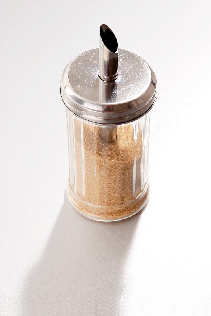 A sugar shaker filled with brown sugar