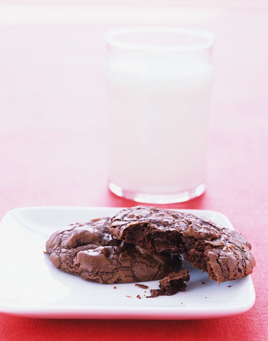 Outrageous chocolate cookies with glass of milk