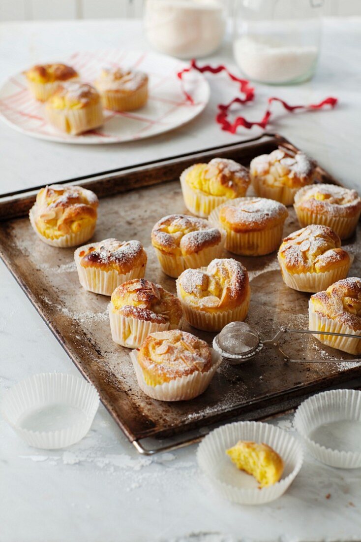 Saffron tartlets with oranges on a baking tray