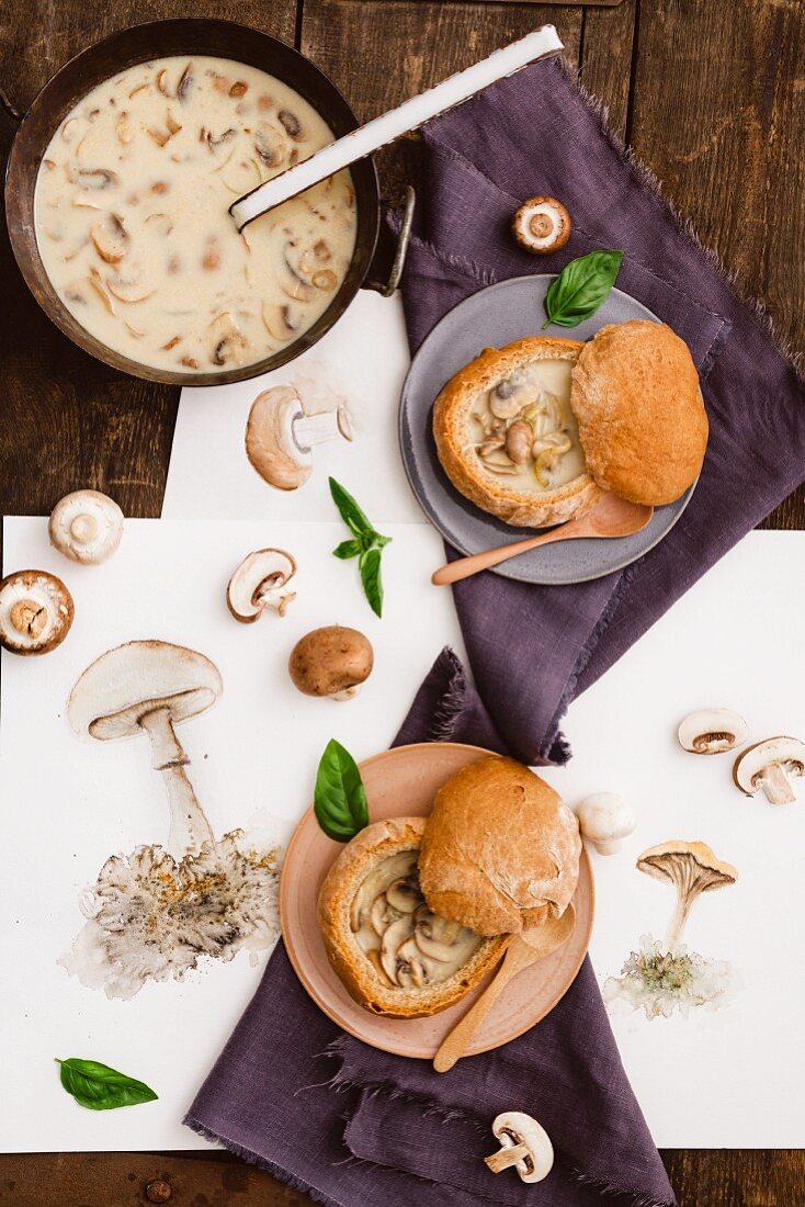 Cream of mushroom soup in bowls made out of bread rolls