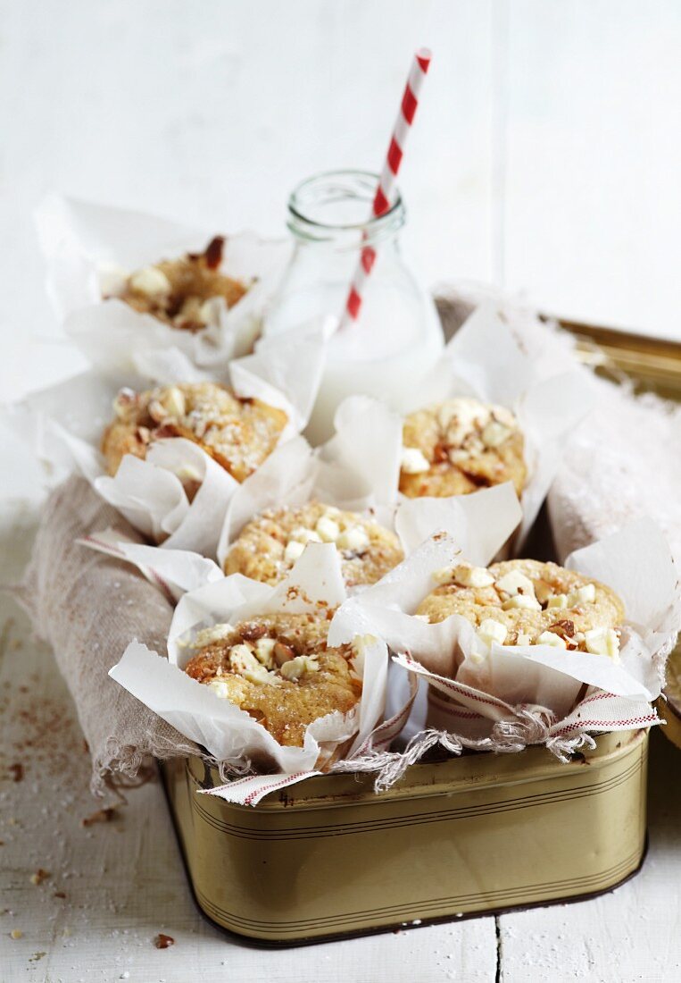 Blondies and a bottle of milk in a tin container