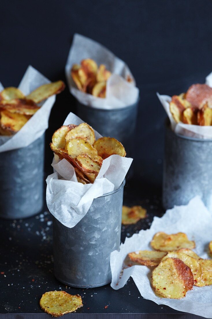 Home-made potato crisps in zinc pots
