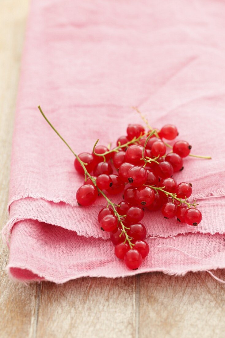 Redcurrants on a pink cloth