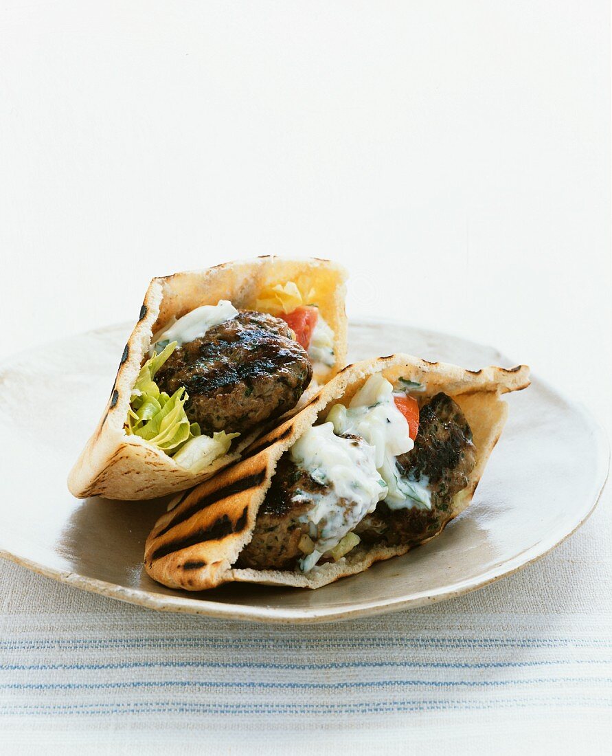 Pita bread filled with meatballs and tzatziki