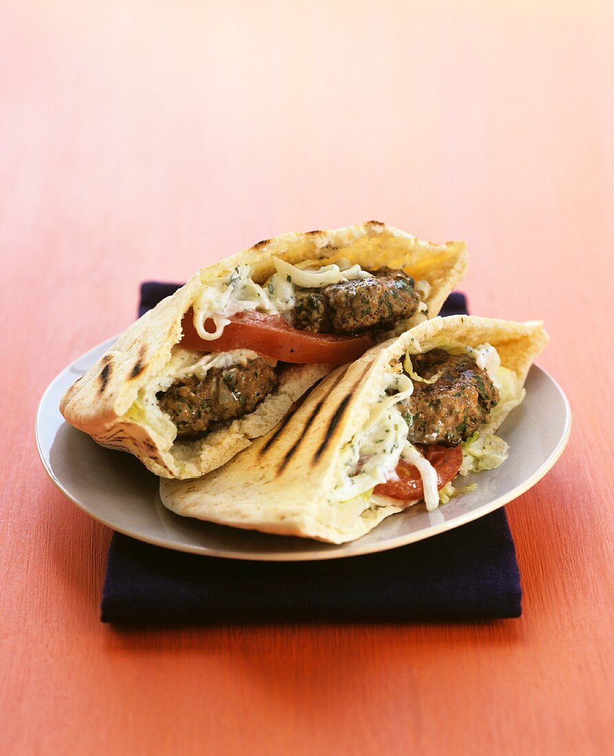 Grilled pita bread filled with mini burgers