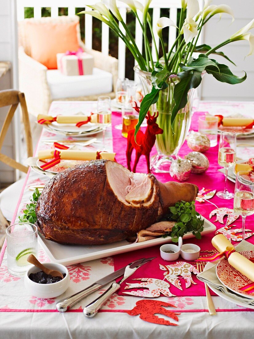 Baked ham with quince glaze on the Christmas table