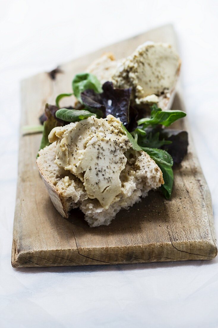 Goose liver on bread and salad