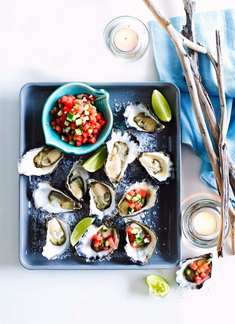 Oysters with a watermelon & cucumber relish and limes