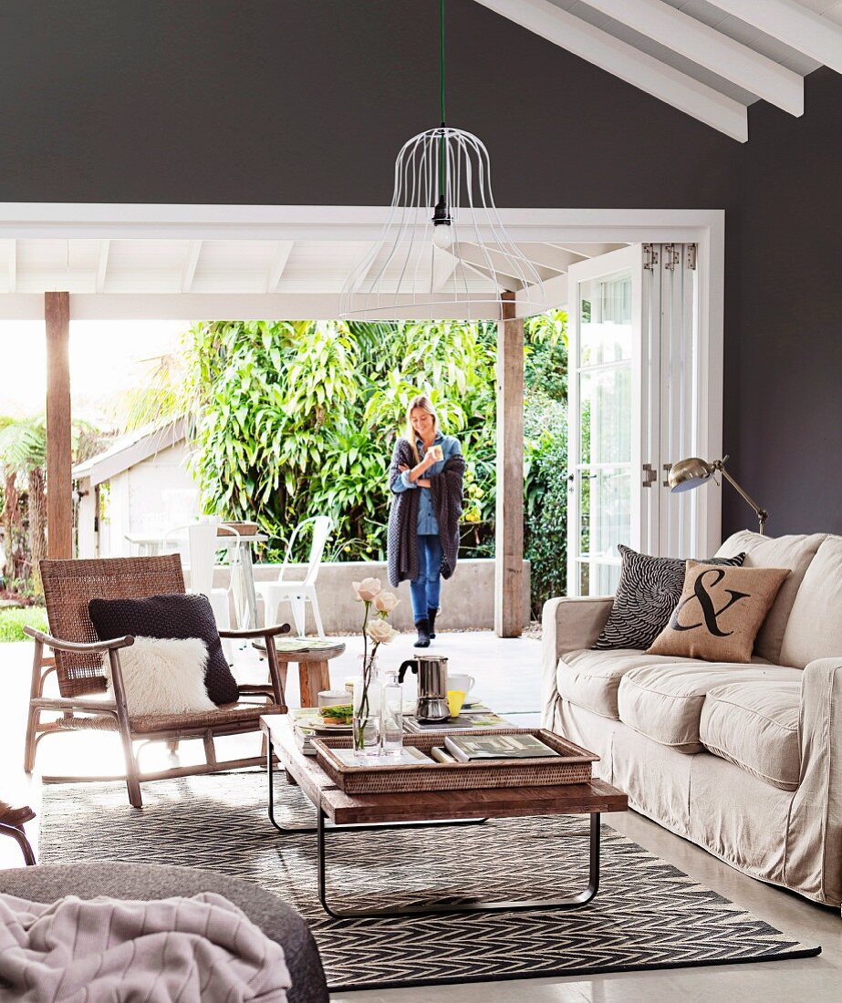 Living room in natural shades with open terrace door