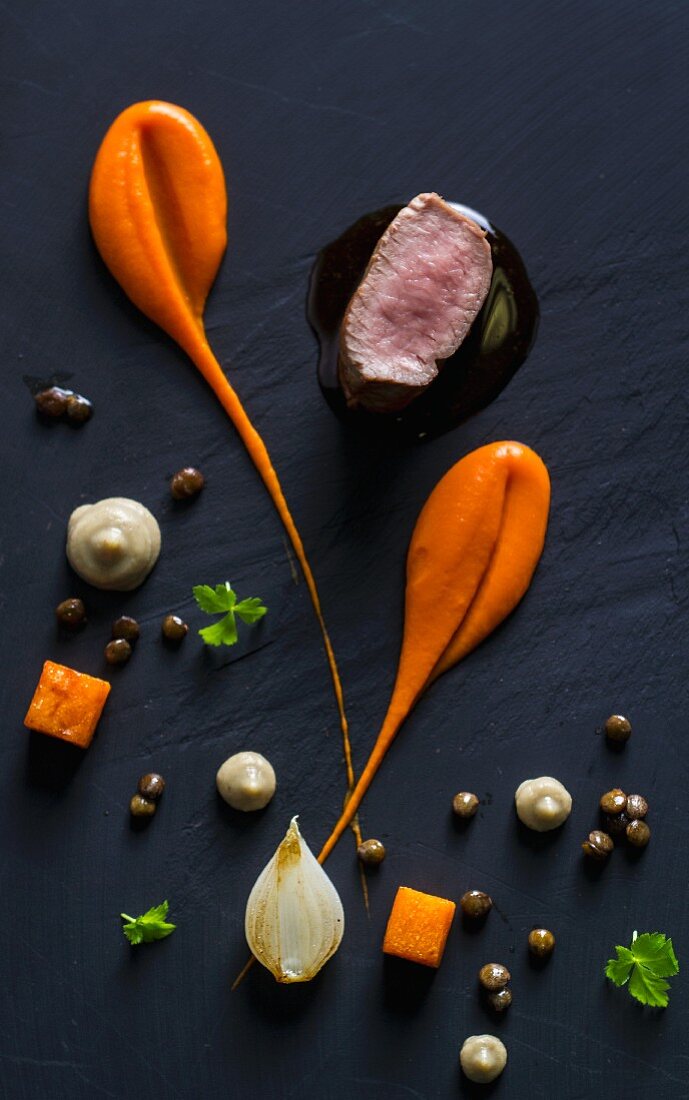 Lamb loin with pumpkin puree lentil and onion